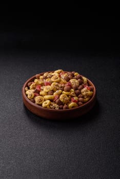 Flakes, chocolate balls and dried fruit for a hearty breakfast. Granola with chocolate flakes
