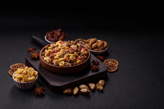 Flakes, chocolate balls and dried fruit for a hearty breakfast. Granola with chocolate flakes