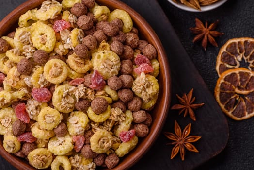 Flakes, chocolate balls and dried fruit for a hearty breakfast. Granola with chocolate flakes