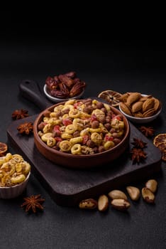 Flakes, chocolate balls and dried fruit for a hearty breakfast. Granola with chocolate flakes