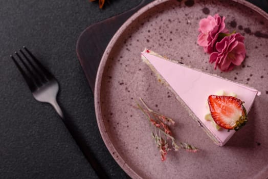 A slice of pink colored puff cake for a birthday celebration. Sweets to celebrate a wedding or valentine's day
