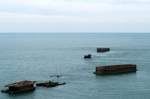 The ruins of the artificial Mulberry harbor of Arromanches-les-Bains, Calvados, France