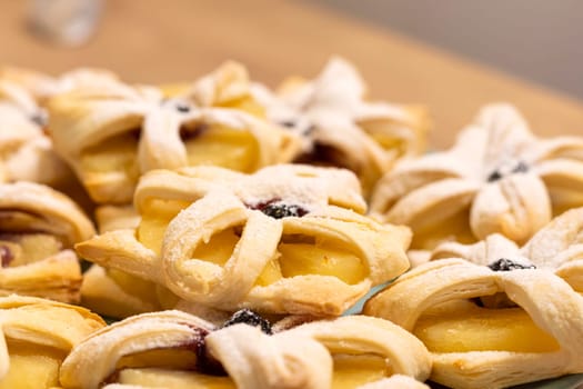 Freshly baked fruit puff pastries on the ceramic plate