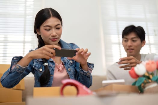 This couple captures images of their products, combining marketing and creativity to enhance their online presence while enjoying their entrepreneurial journey.