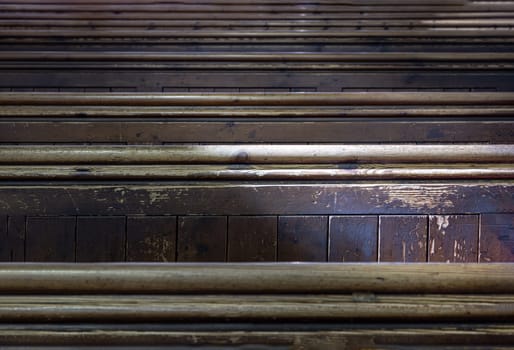 Windsor, UK - Apr 03, 2025 - Sunlight filtered through rows of Traditional church benches inside the church. View of The edge of the wooden pews, use it as your Wallpaper, Poster and Space for text, Selective focus.