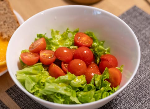 Bawl with cherry tomatoes and lettuce leaves