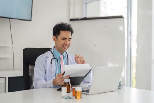 In a comfortable setting, the physician reviews patient information while connecting deeply through an online consultation, enhancing patient engagement.