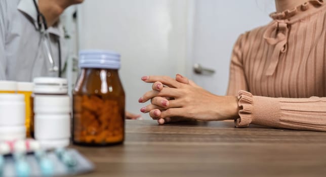 A doctor and patient engage in a detailed conversation about the patient's health, discussing medications and treatment options collaboratively.