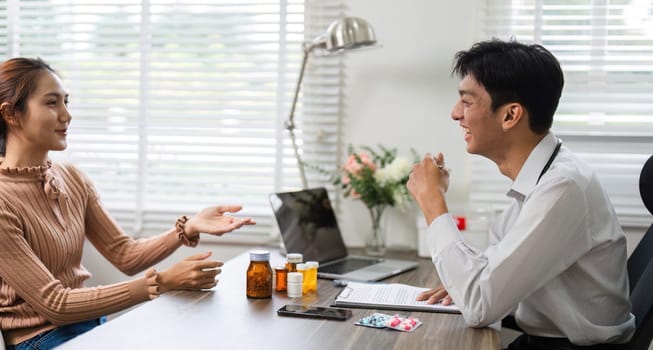 A doctor listens attentively as a patient describes her concerns, showcasing the essential interaction in healthcare consultations.