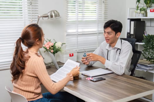 The healthcare expert converses with a patient about her medication regimen, ensuring she comprehends treatment instructions in a supportive atmosphere.