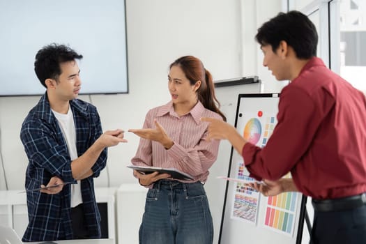 Amidst varying perspectives, the team engages in a constructive dialogue, showcasing their commitment to collaborative problem-solving in a design-centered discussion.