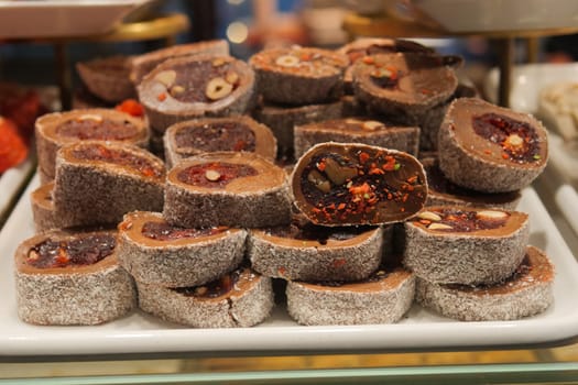 Charming display of turksih delight sweet rolls in a shop.