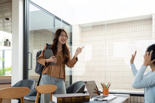 A university student animatedly discusses academic topics with classmates, fostering an interactive learning environment.