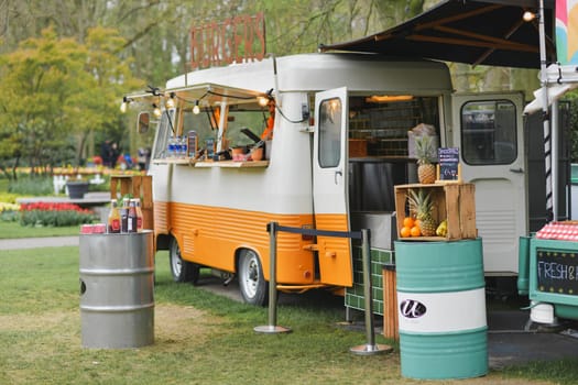 Lisse, Netherlands - April 17, 2019: Mobile bar minivan on wheels for selling snacks and smoothies in a Keukenhof park Decoration