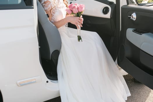 Bride holds a wedding bouquet, wedding dress, wedding details