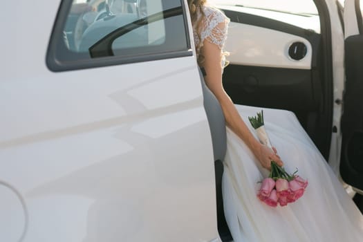 Bride holds a wedding bouquet, wedding dress, wedding details