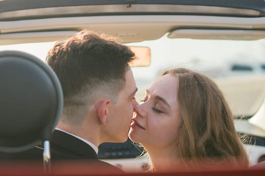 beautiful wedding couple in park. kiss and hug each other