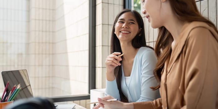 The environment fosters camaraderie as the students discuss coursework and share knowledge while enjoying a beverage.