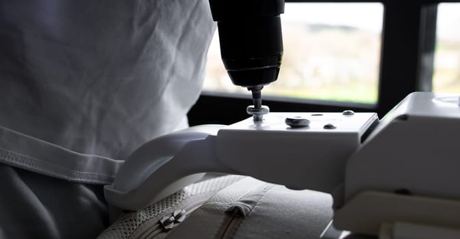 Close up of medical equipment with drill attachment in use.