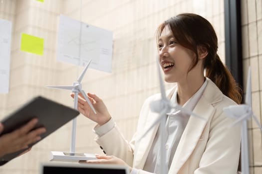 A lively exchange where professionals discuss innovative wind energy solutions, illustrating their dedication to sustainable practices within the ESG framework.