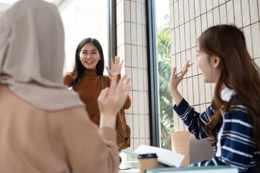 Three friends meet at a cozy cafe to discuss school projects, enjoy their favorite beverages, and reconnect during a study session, highlighting the joy of camaraderie.