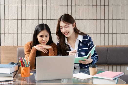 Friends support each other while examining their notes and discussing project topics, creating an inviting environment for learning and collaboration.