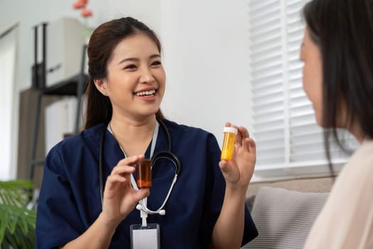 A caregiver engages with an elderly patient, explaining the importance of the medications in a friendly and informative manner, fostering trust and effective communication.