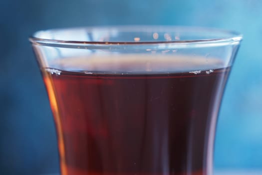 turkish tea against a blurred blue background.