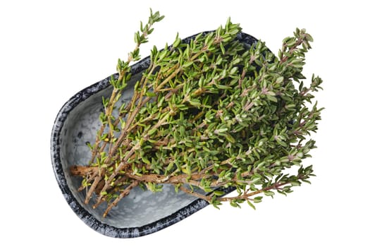 Vibrant green thyme sprigs are neatly placed in a stylish bowl, showcasing their aromatic leaves. This arrangement highlights the herb's beauty, perfect for enhancing various dishes.