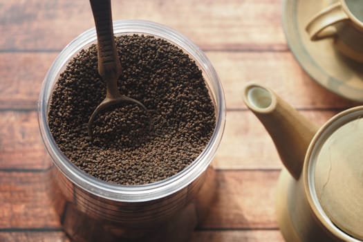 loose tea in a container on table ,