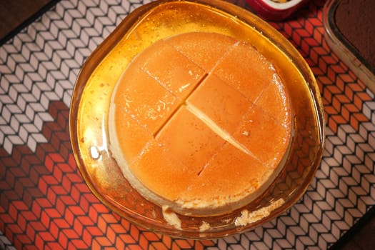 Delicious caramel dessert displayed on a decorative plate.