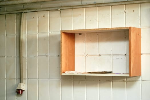 a flat length of wood or other rigid material, attached to a wall or forming part of a piece of furniture