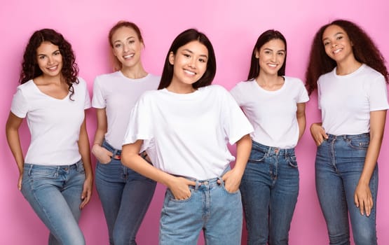 Cheerful Asian Woman With Diverse Group Of Ladies Standing Together Smiling To Camera Over Pink Background. Diverse Beauty Concept, Female Multicultural Group Posing In Studio