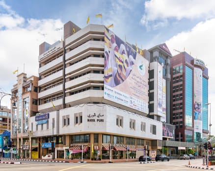 Bandar Seri Begawan, Brunei - Feb. 24, 2025: Vibrant urban landscape of the capital city's downtown streets, characterized by towering structures that showcase a diverse range of architectural styles