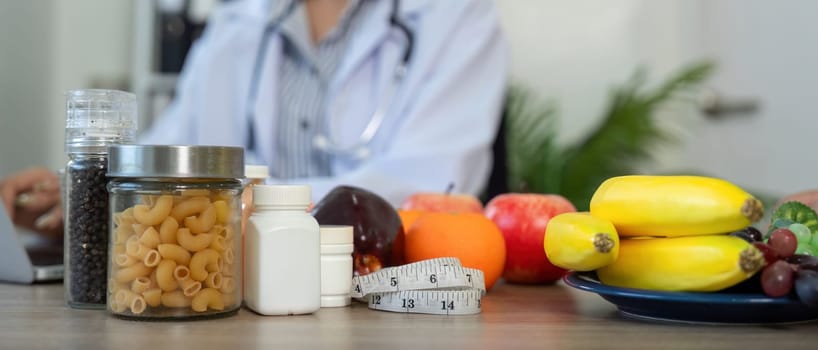 During a nutrition counseling session, a healthcare professional discusses various food options and supplements, emphasizing their importance for a balanced diet.
