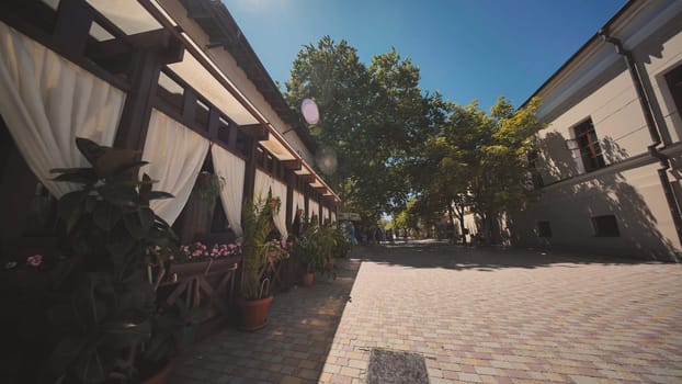 Charming Crimean street cafe basking in the summer sun, offering a relaxing atmosphere