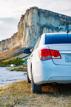 hite car parked near White Rock mountain in Crimea.