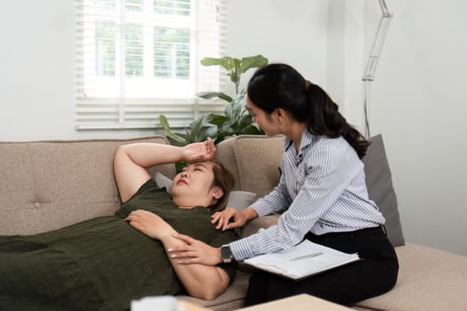 During a therapy session, a psychiatrist helps a distressed patient manage her feelings, exemplifying patience and understanding in a supportive atmosphere.
