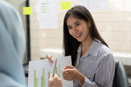 During a corporate discussion, one professional shares insights about data trends related to ESG practices, fostering collaboration for better sustainability strategies.