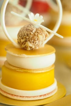 A vibrant dessert with cream, fruit, and nuts in delightful layers.