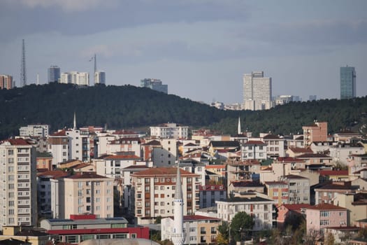 Residential buildings contrast against hills in a dynamic urban setting.