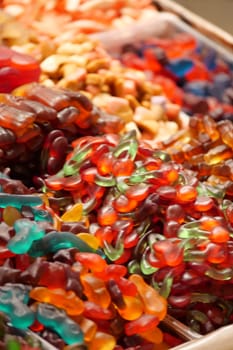 Vibrant assortment of gummy bears and candy shapes attracting visitors.
