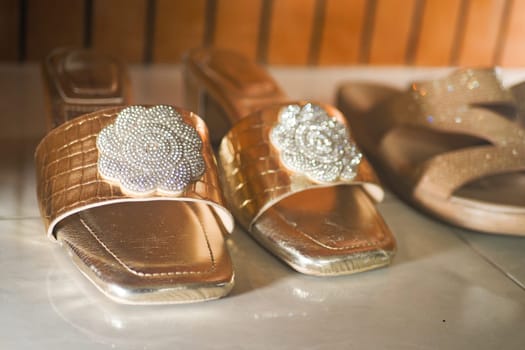 Two pairs of fashionable sandals displayed in a shop with elegant designs.