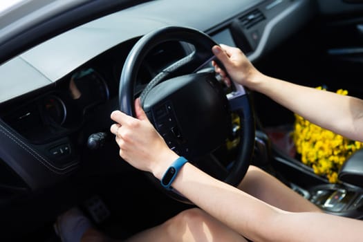 Young girl driving a car, handing over the right to drive a car