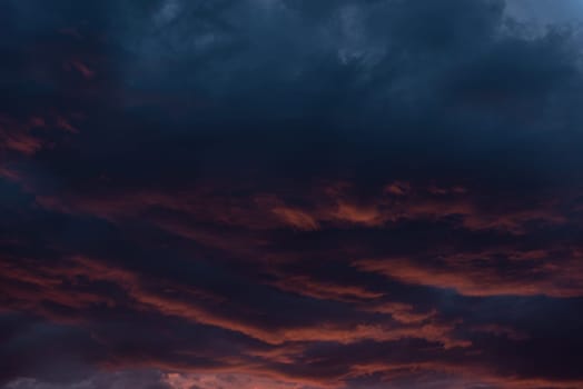 Find solace in the tranquil allure of twilight, as the sky is adorned with soothing shades of orange and blue, accompanied by wispy clouds, offering a serene retreat for your desktop sanctuary