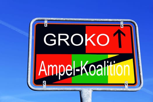 Traffic sign from the traffic light coalition to the Groko in Germany in the different colors of the parties