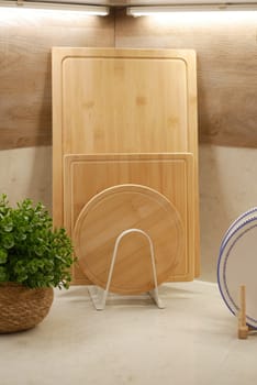 A display of wooden cutting boards arranged on a kitchen countertop.