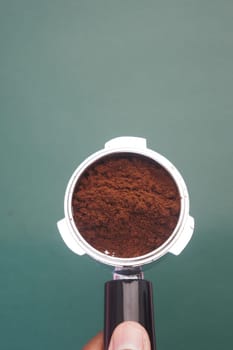 Freshly ground coffee nestled in a portafilter, ready for brewing.