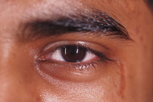 A detailed shot of a human eye displaying various emotions and reflections.