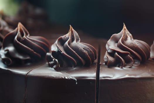 Decadent chocolate cake topped with rich, elegant frosting swirls.